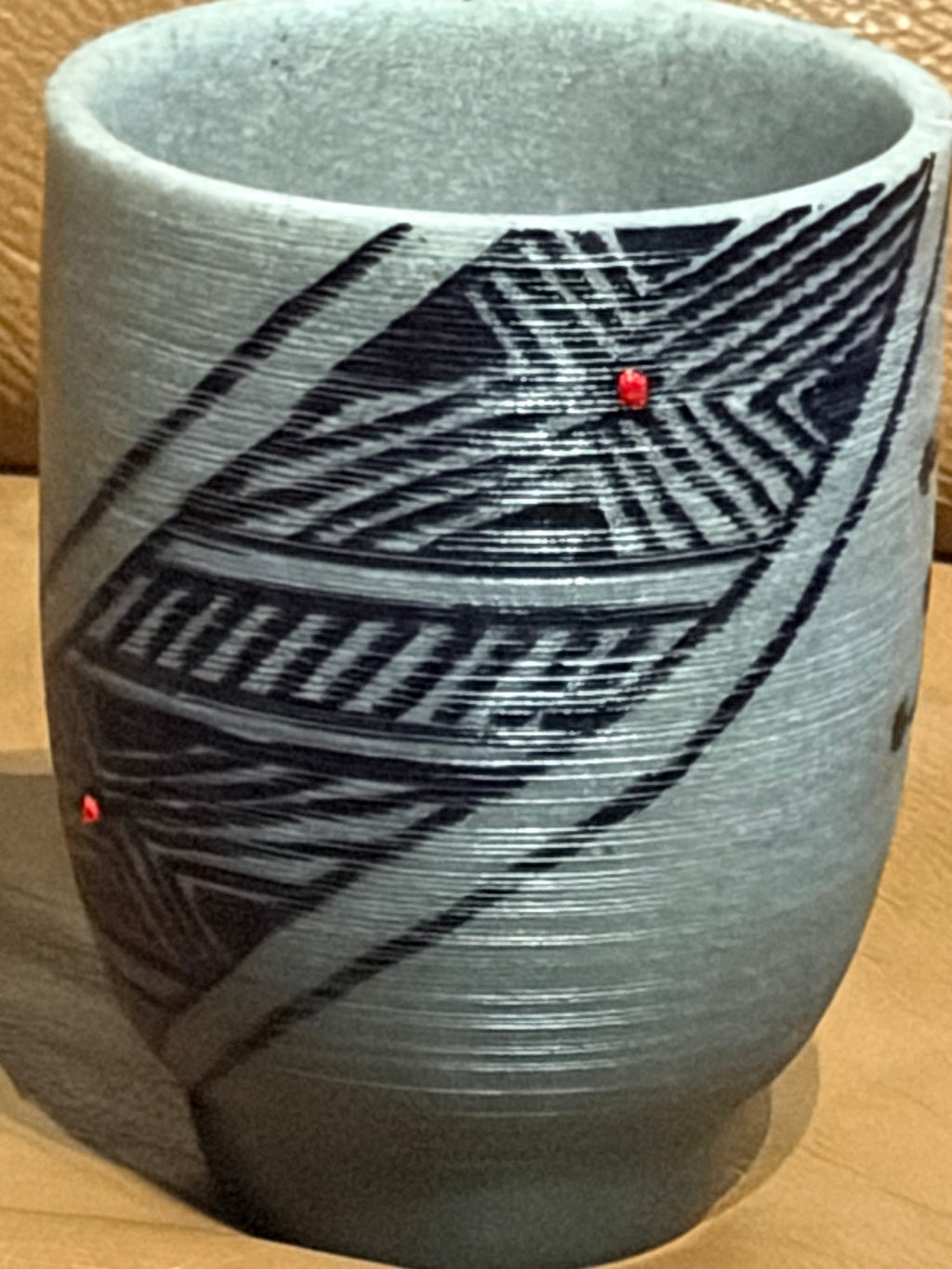 Blue Gray Cup with Designs and Red Dot